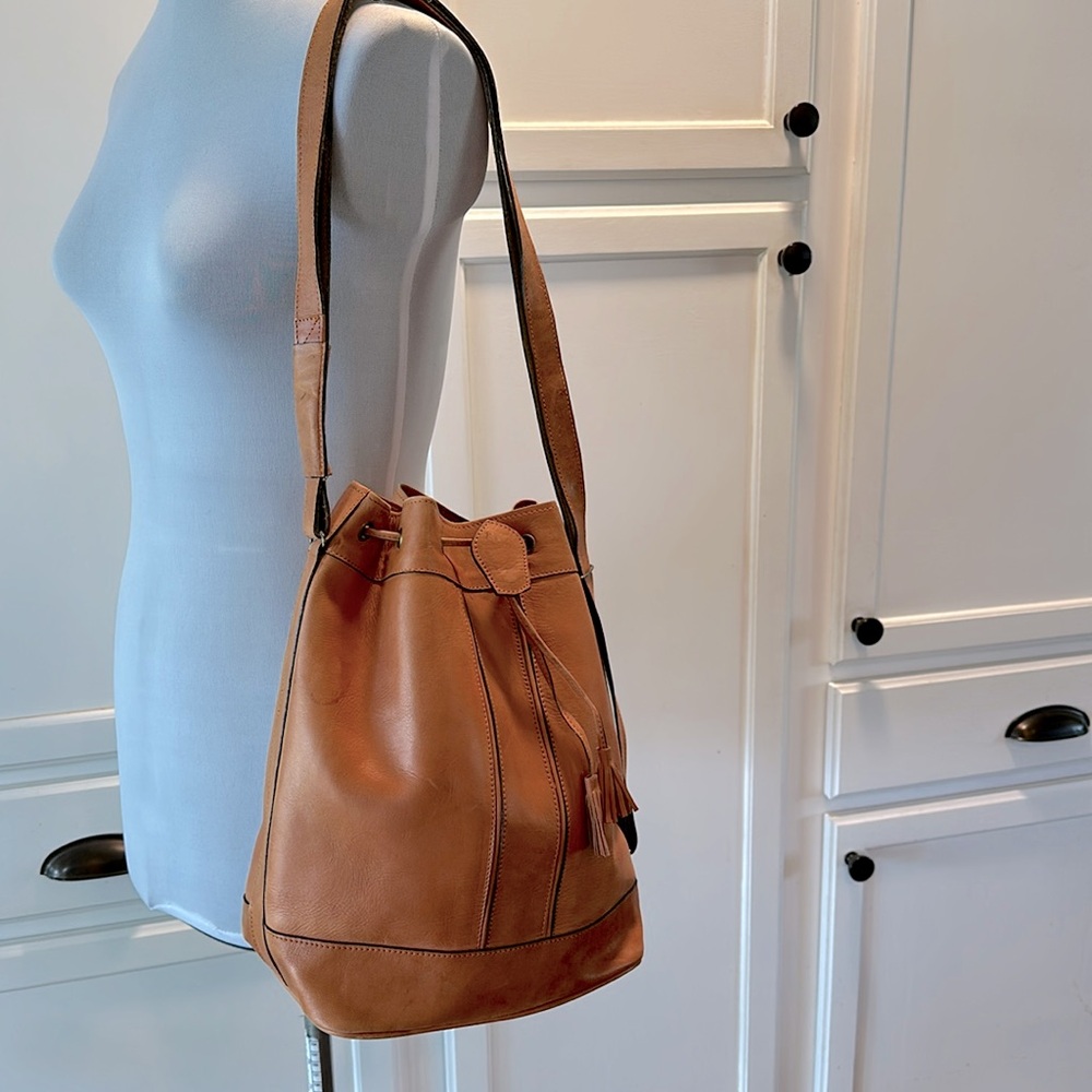 Genuine leather cognac colored bucket shoulder bag with cinch close. - Picture 2 of 5